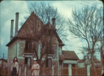 Dorothy with Marie Therese in front of the Mayor’s house.  We (the McCann family) lived in the upper floor of this house