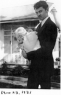 Albert Hews McCann, Jr.  holding daughter, Dorothy as infant
